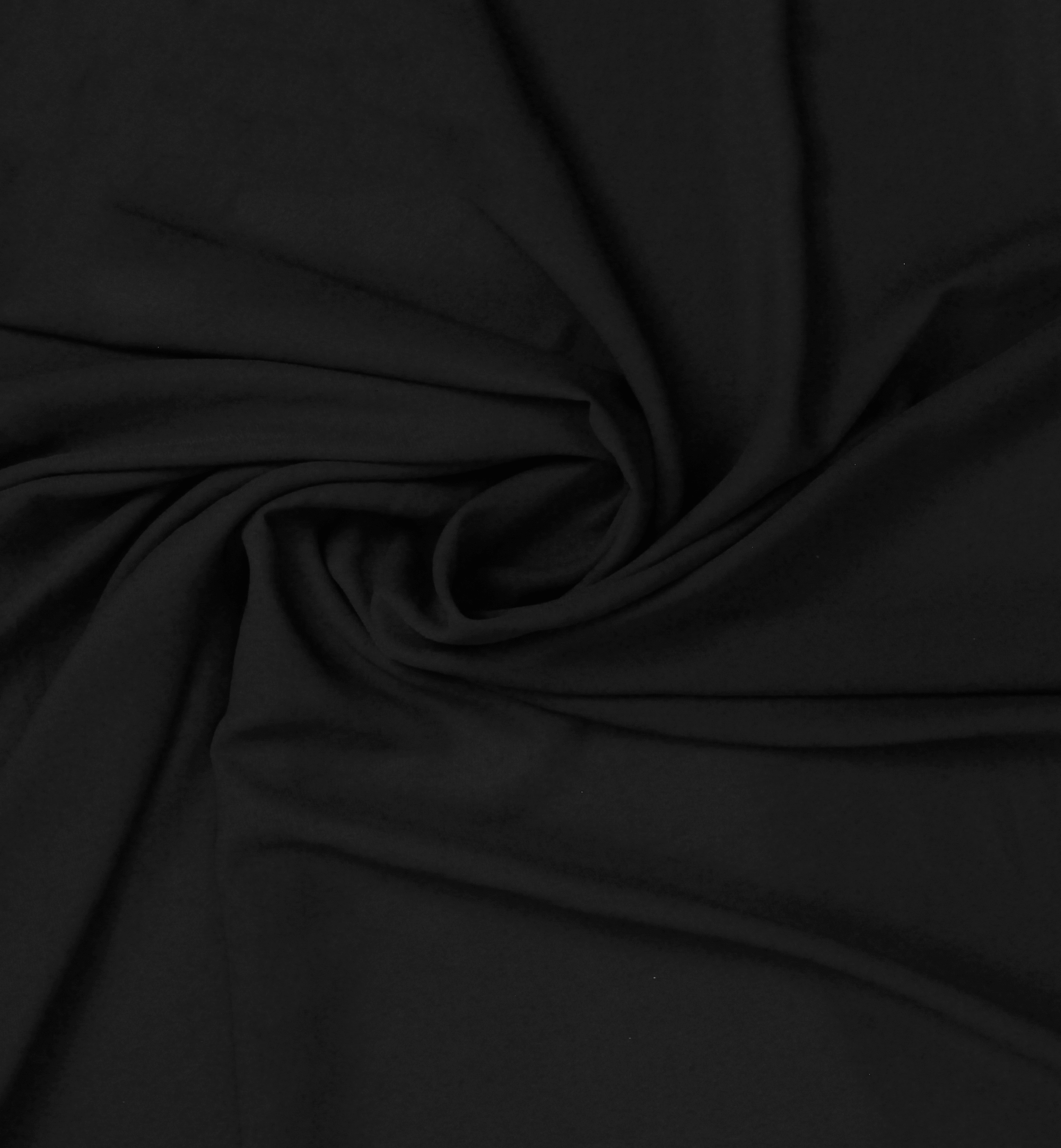 A solid black georgette fabric twisted into spiral.